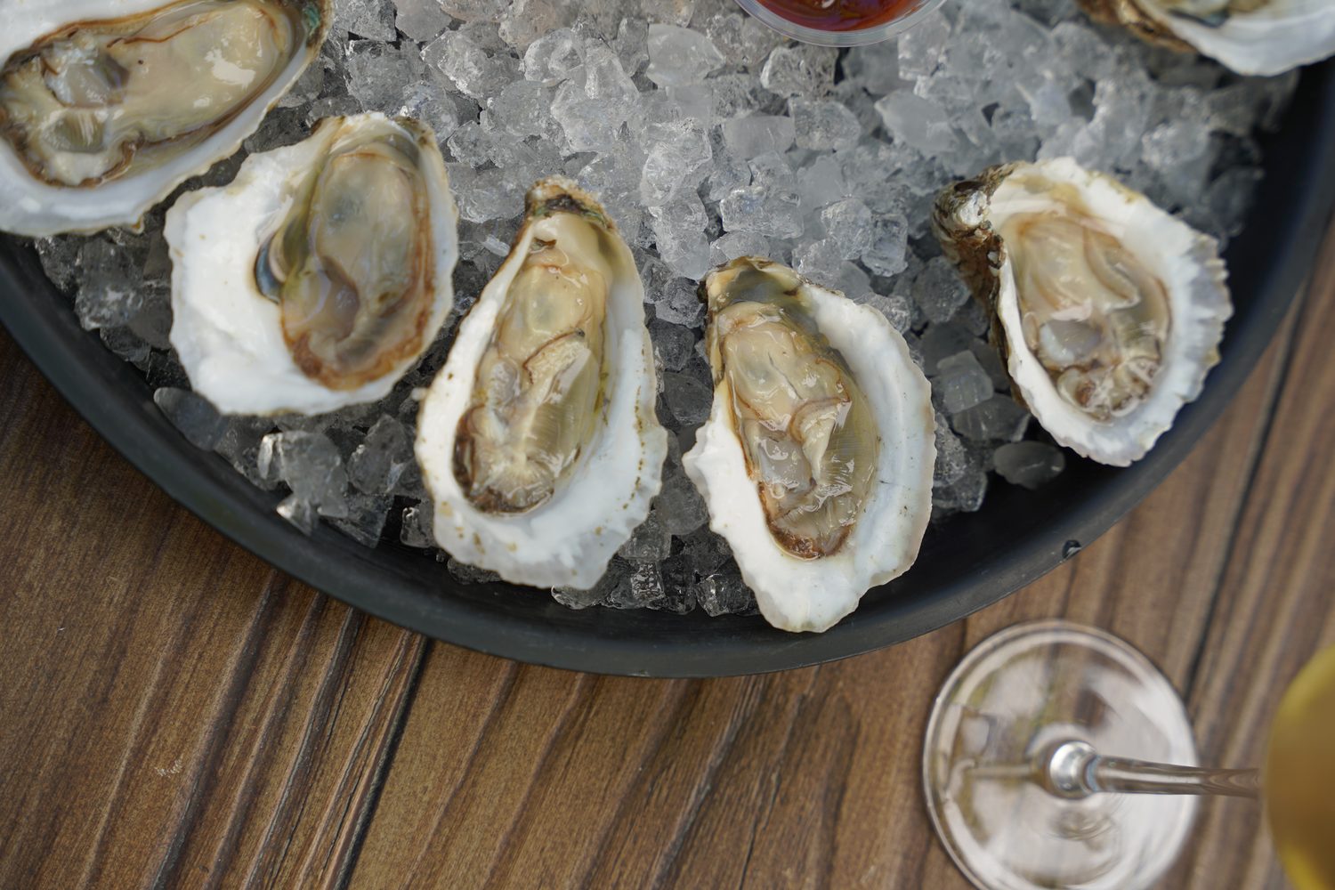 Raw oysters on the half shell over crushed ice.